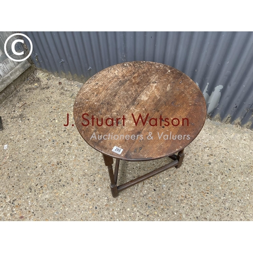 295 - An antique oak cricket table 64 diameter 68h