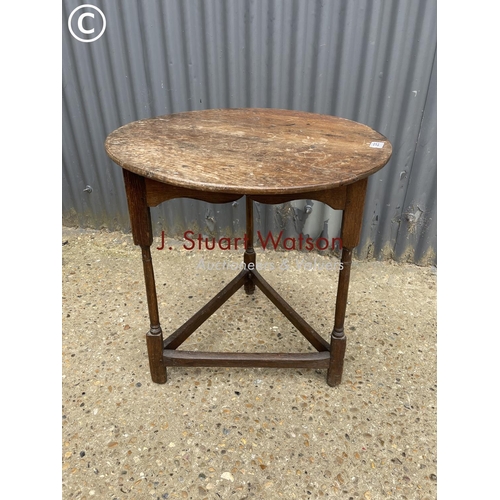 295 - An antique oak cricket table 64 diameter 68h