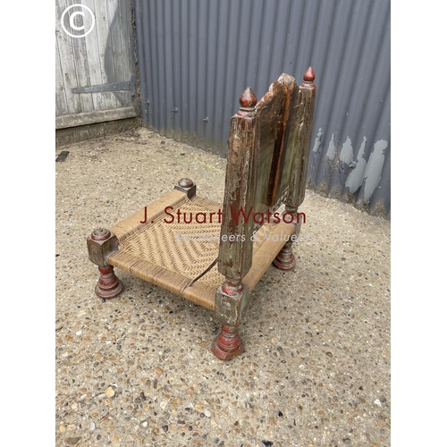 299 - A low oriental prayer chair