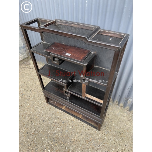 303 - An oriental hardwood bookcase on stand 87x22x122