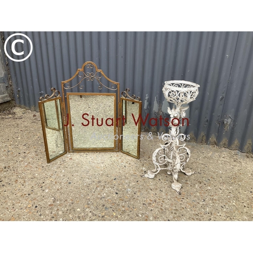 311 - An ornate; metalwork plant stand together with a gold painted metal framed mirror