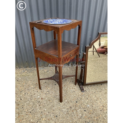 314 - An Edwardian mahogany washstand with blue and white bowl  together with an oak swing mirror