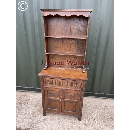 337 - A small oak dresser with linenfold carved front