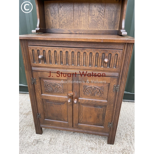 337 - A small oak dresser with linenfold carved front