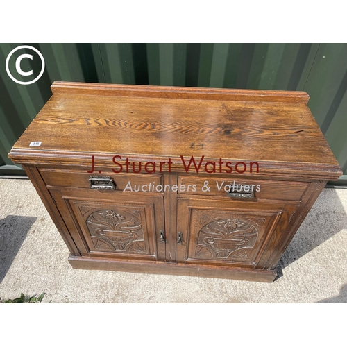 345 - An Edwardian oak two drawer sideboard