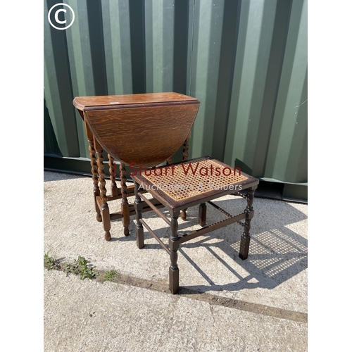 360 - An oak barley twist gate leg table together with a begere stool