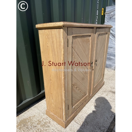 362 - A pine two door larder cupboard 120x33x103