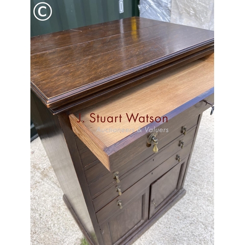 369 - An early 20th century oak collectors chest with six lockable drawers over cupboard 65x48x1 00