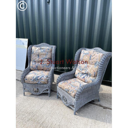 370 - A pair of grey wicker wing back conservatory chairs