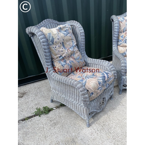 370 - A pair of grey wicker wing back conservatory chairs