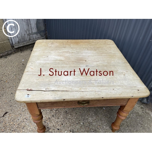 38 - A vintage pine kitchen table with singe drawer  104x107