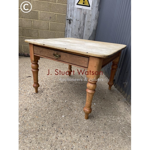 38 - A vintage pine kitchen table with singe drawer  104x107