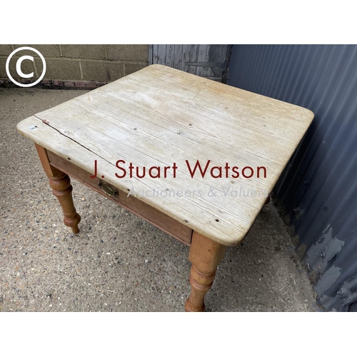 38 - A vintage pine kitchen table with singe drawer  104x107