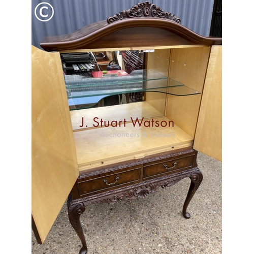 41 - A reproduction walnut drinks cabinet with two drawers