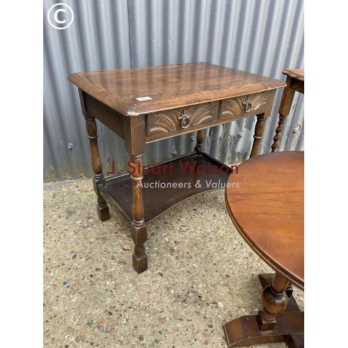 47 - An oak two drawer table  together with a barley twist table and one other