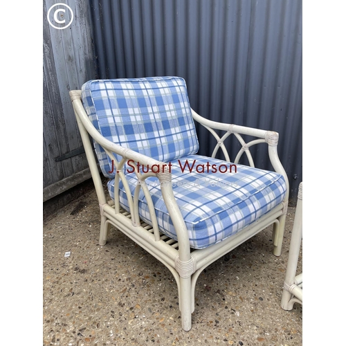 5 - A white bamboo chair together with matching glass top side table