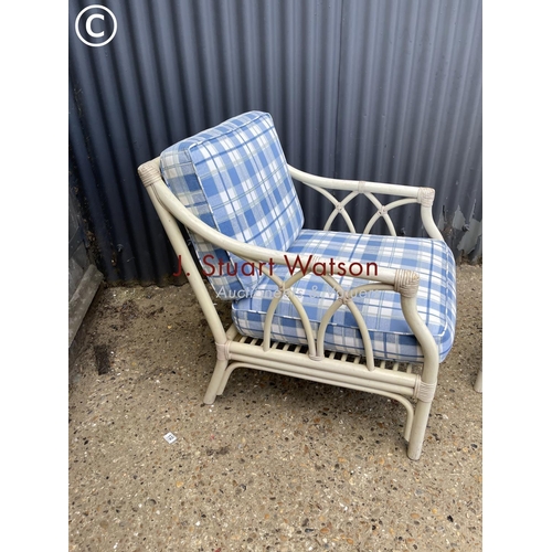 5 - A white bamboo chair together with matching glass top side table