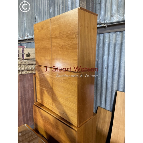 50 - A collection of teak tapley 33 wall box system consisting of 4 cupboards, 3 cabinets and other shelv... 