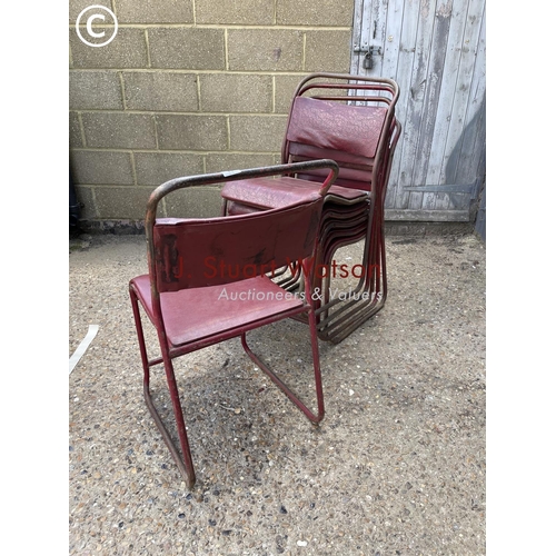 56 - A stack of six vintage red stacking chairs, some in distinctly marked RAF