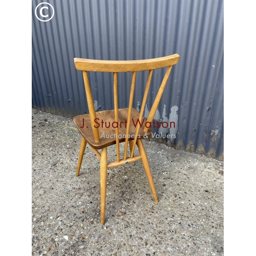 60 - An ercol stick back kitchen chair