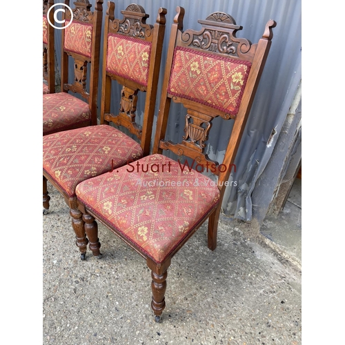 62 - A set of four Edwardian dining chairs with upholstered seats