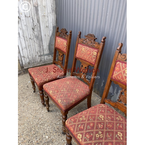 62 - A set of four Edwardian dining chairs with upholstered seats