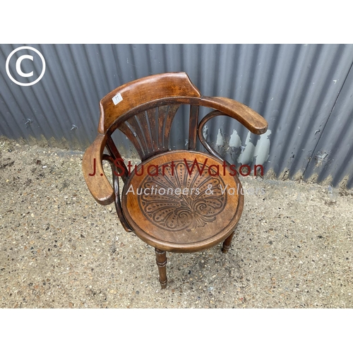 77 - A bentwood carver chair