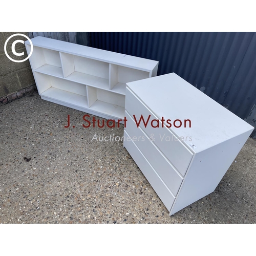 8 - A painted ply chest of three together with a painted open fronted bookcase