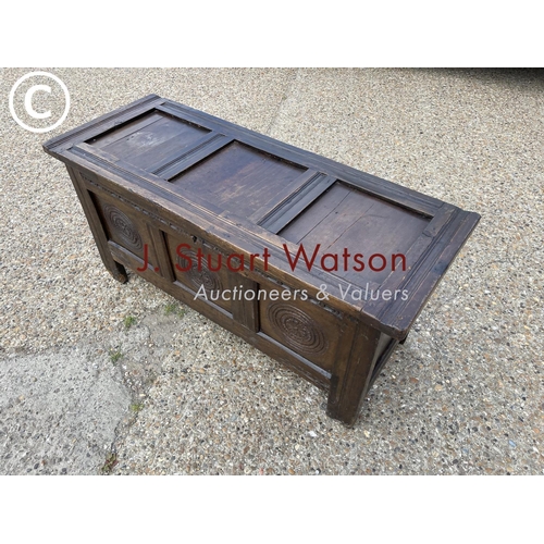 84 - An antique oak blanket box chest