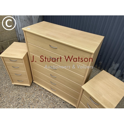 91 - A tallboy chest of six together with a pair of matching bedsides