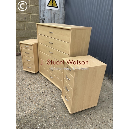 91 - A tallboy chest of six together with a pair of matching bedsides