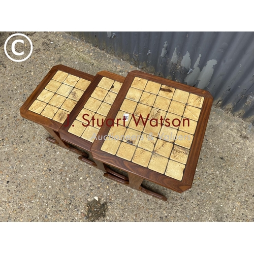 96 - A Nathan teak nest of three occasional tables with tiled top