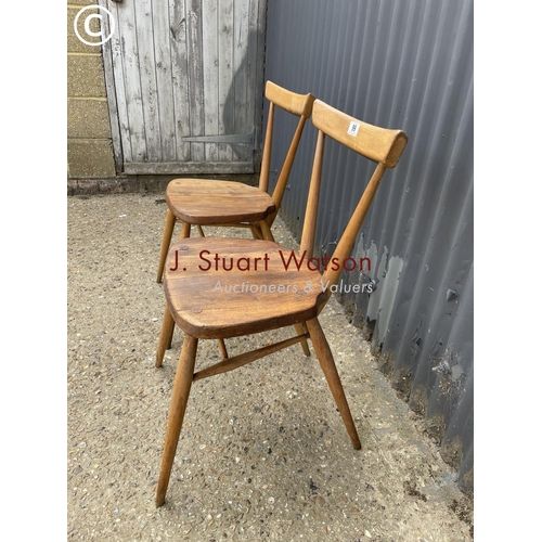 99 - A pair of ercol stacker chairs