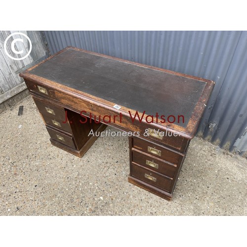 282 - A mahogany campaign style desk with military handles  122wide