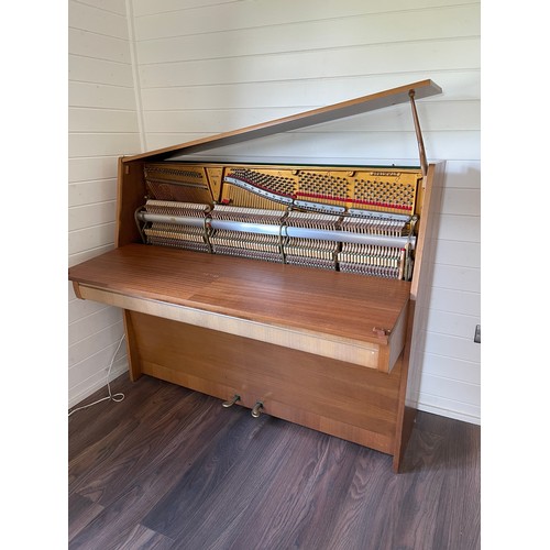 349 - Steinway Model V upright piano with a teak case. Made in Hamburg. Piano has an eighty-eight note key... 