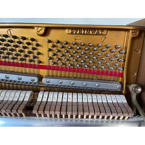 349 - Steinway Model V upright piano with a teak case. Made in Hamburg. Piano has an eighty-eight note key... 