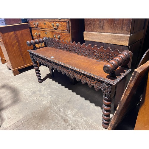 281 - A carved oak window seat 122cm wide