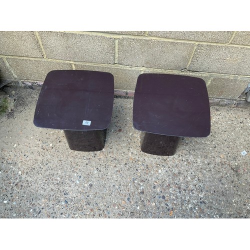 69 - A pair of aubergine coloured metal side tables by VITRA