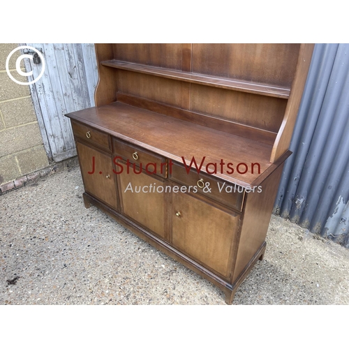 333 - A stag minstrel three drawer dresser