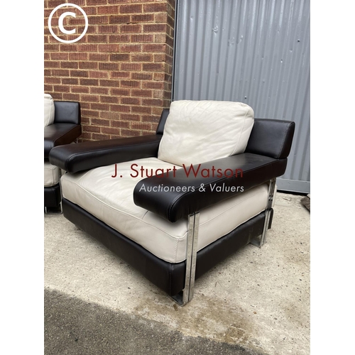 339 - A pair of Italian style (natuzzi or similar) brown and cream leather armchairs in chrome bases