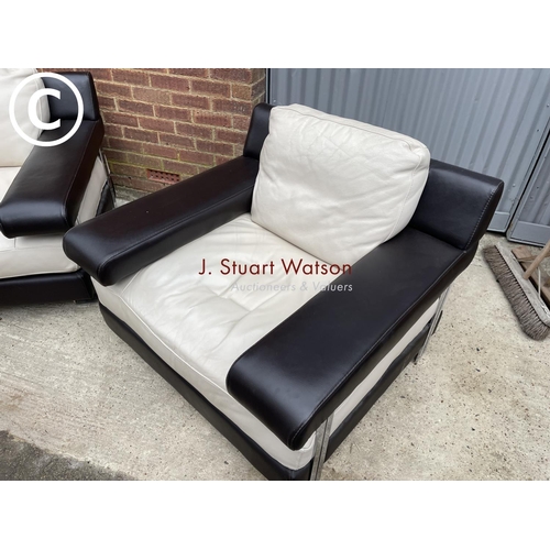 339 - A pair of Italian style (natuzzi or similar) brown and cream leather armchairs in chrome bases