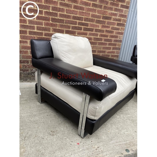 339 - A pair of Italian style (natuzzi or similar) brown and cream leather armchairs in chrome bases