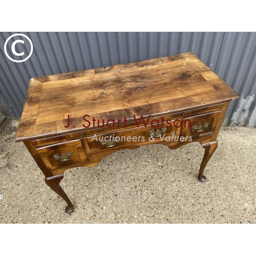 345 - An early walnut  three drawer lowboy table