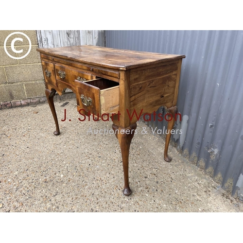 345 - An early walnut  three drawer lowboy table