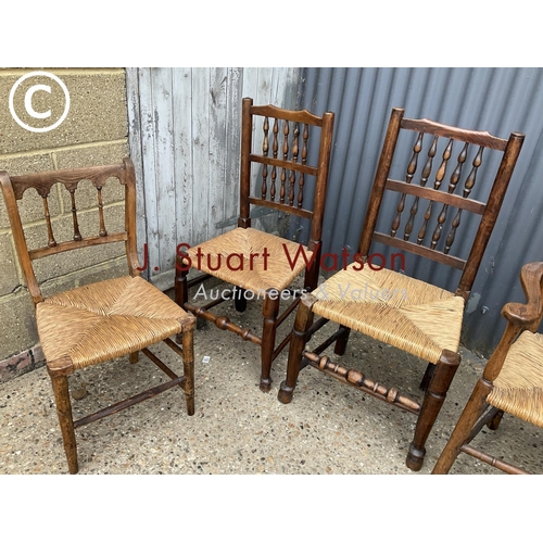 348 - Five assorted rush seat dining chairs including carver