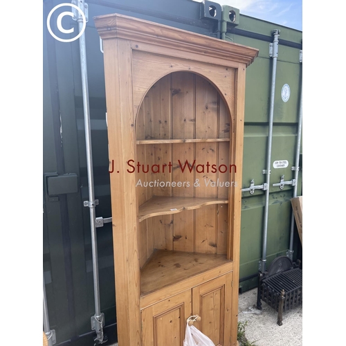 350B - A large country pine corner cupboard with open front over cupboard doors
