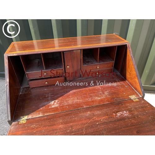 350E - An Edwardian mahogany bureau with satinwood inlay and fitted to the interior