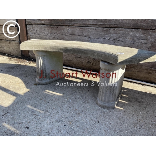 490A - A curved concrete garden seat
