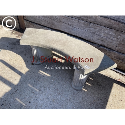 490A - A curved concrete garden seat