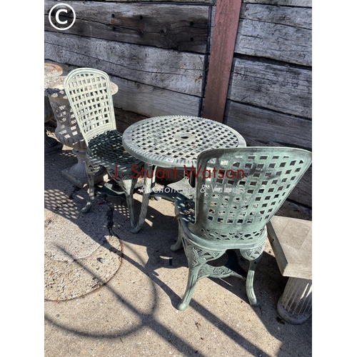 490B - A green plastic garden table and two chairs